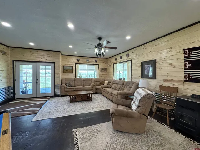 a living room with furniture fireplace and flat screen tv