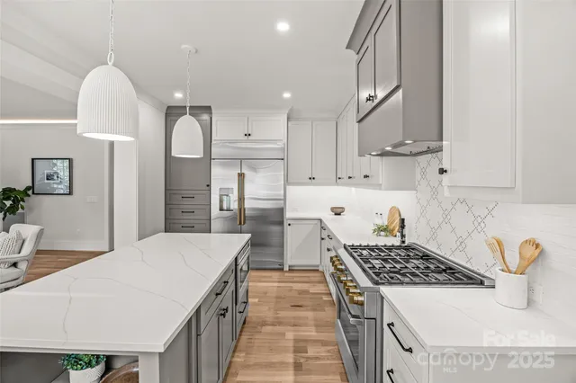 a kitchen with a stove and cabinets