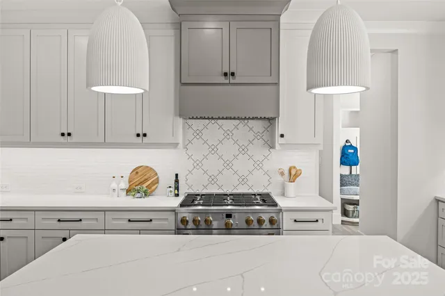 a bed room with a bed and a chair