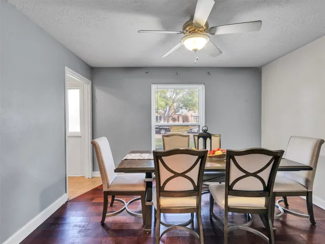 a dining room with furniture and window
