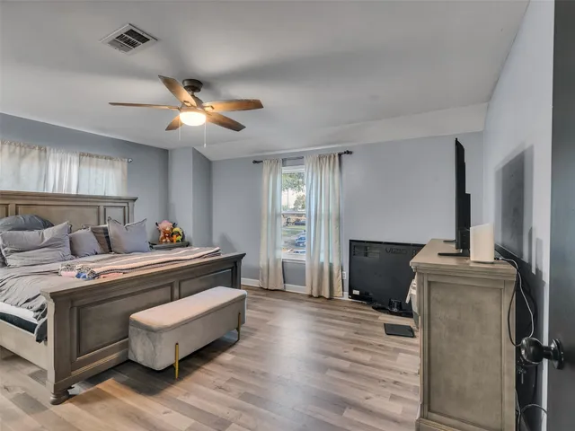 a bed room with a bed and a chandelier