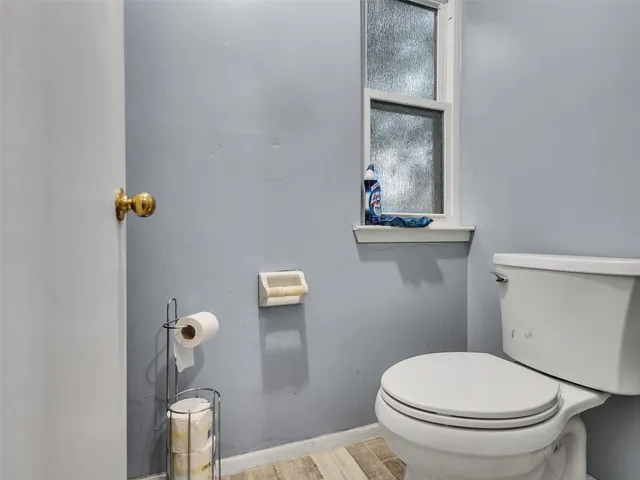 a white toilet sitting next to a bathroom sink