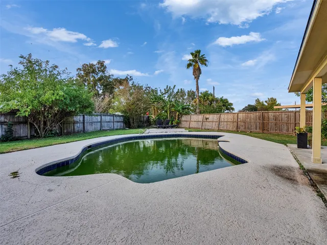 a view of outdoor space and swimming pool