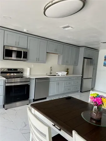 a kitchen with a stove and a microwave