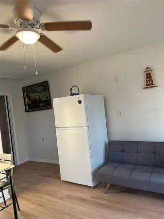 a bedroom with a bed and a mirror