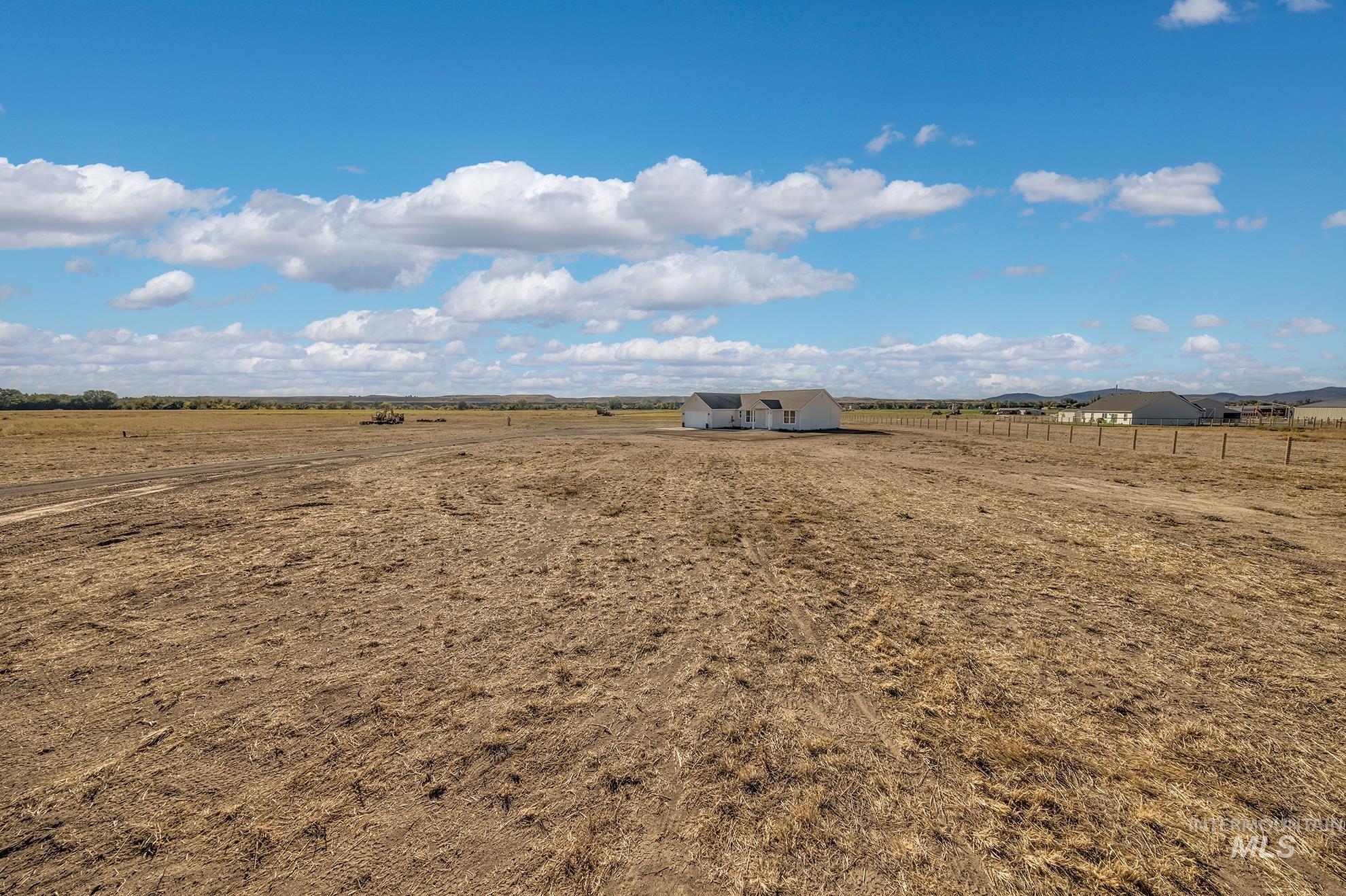 1371 Hansen Road Weiser, ID 83672 - Photo 37 of 44 Expansive acreage featuring a single-story residence with light-colored siding and a contrasting roof
