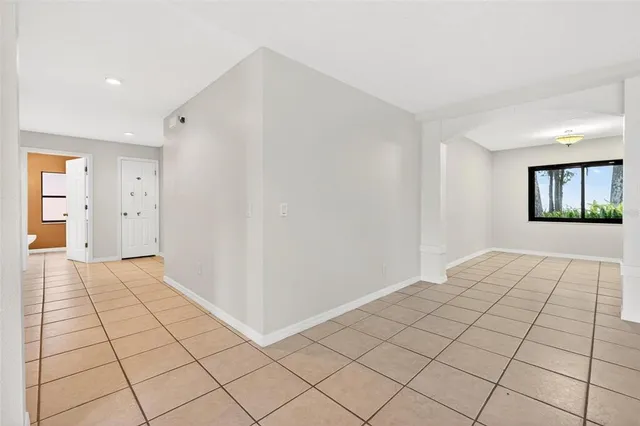 a kitchen with stainless steel appliances granite countertop a refrigerator a stove and a sink with cabinets