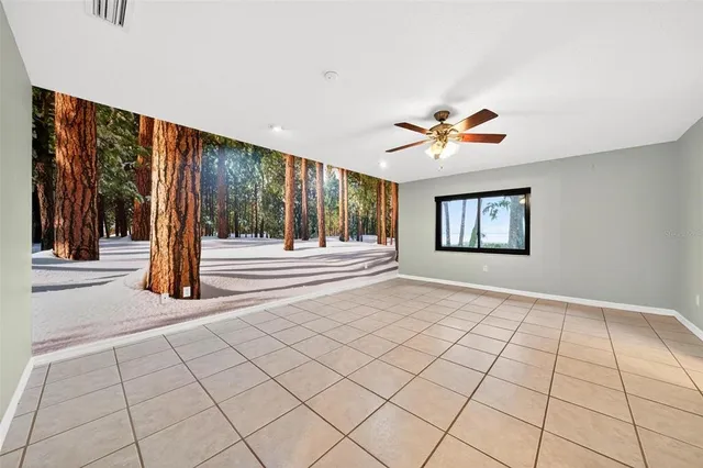 a view of a backyard with a small swimming pool