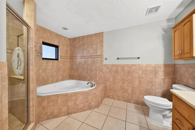 a front view of house with yard space and patio