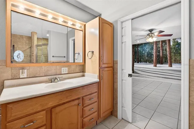 a front view of a house with yard and green space