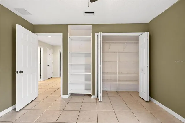 an aerial view of residential building and lake