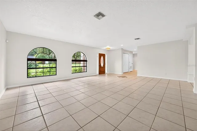 a view of an empty room and window