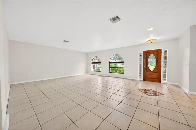 a large kitchen with stainless steel appliances granite countertop a sink and cabinets