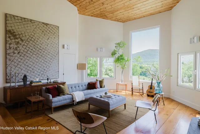 a kitchen with a sink and large window