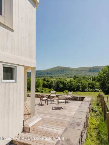 a bedroom with a large bed and a large window