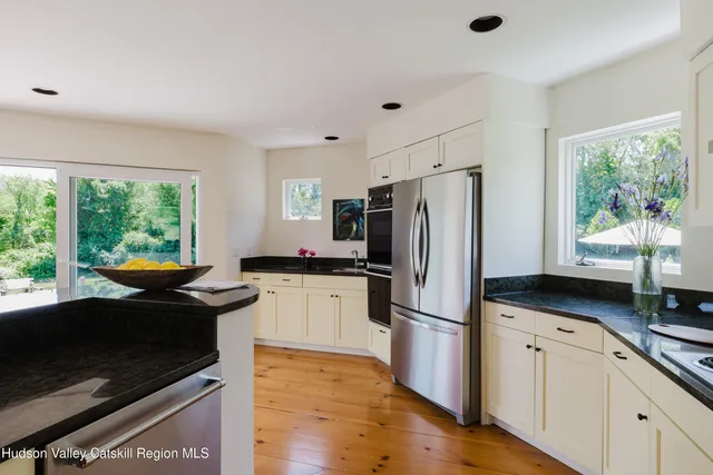 a bedroom with a bed and a bookshelf