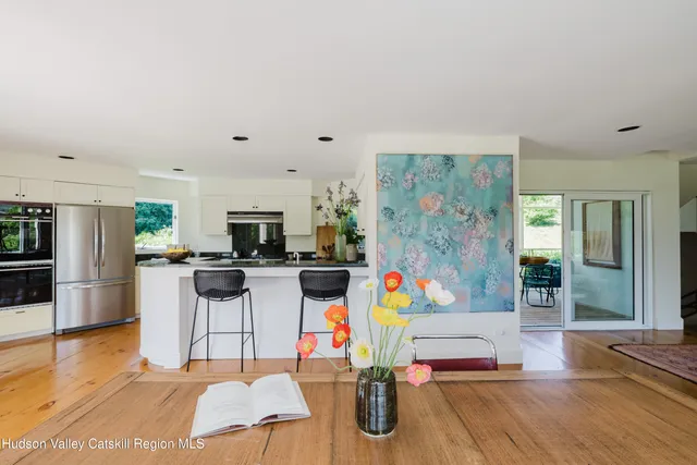 a building with a wall painting on the wall and a shower