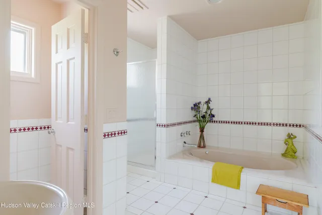 a living room with furniture a rug and a table