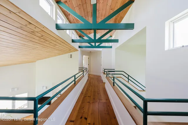 a bedroom with a bed and dresser