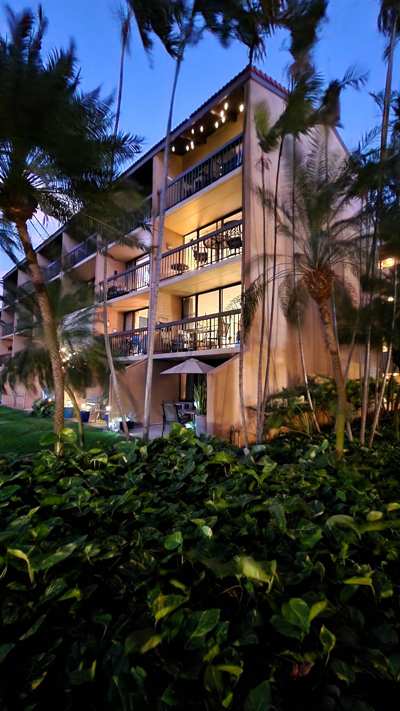 2191 South Kihei Road, Unit 2413 Kihei, HI 96753 - Photo 6 of 34 a front view of a building with a yard