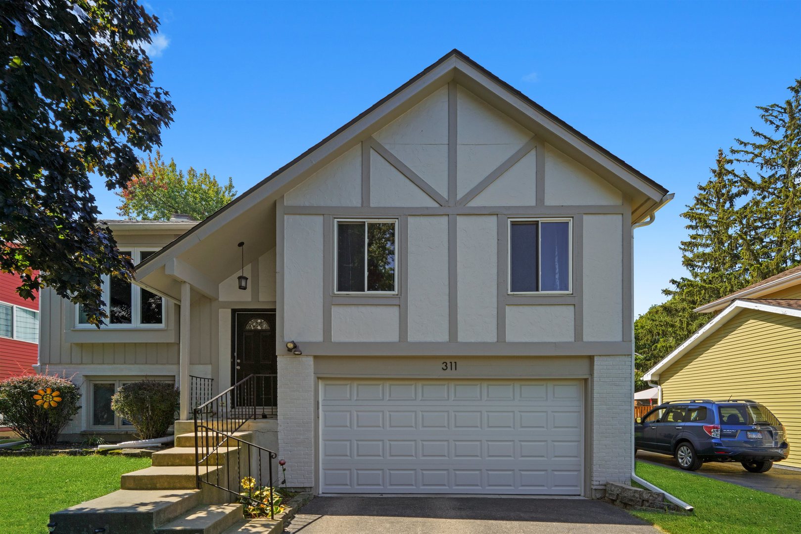 a front view of a house with a yard
