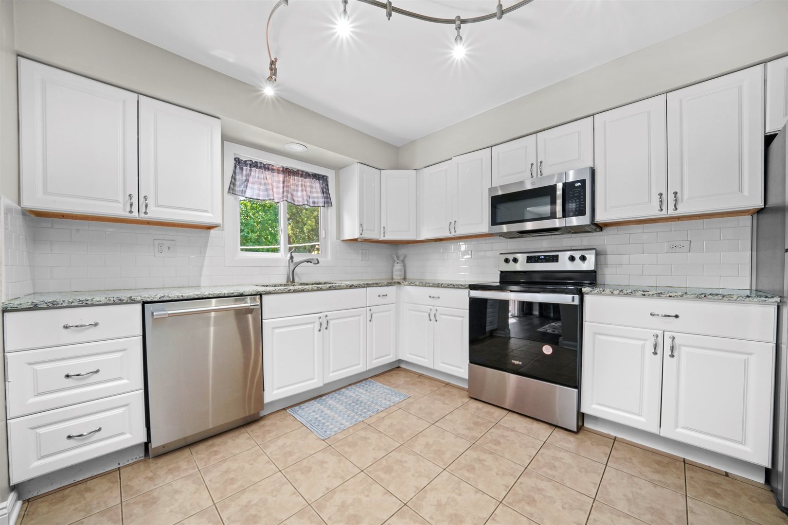 311 Harding Avenue Libertyville, IL 60048 - Photo 11 of 41 a kitchen with cabinets appliances cabinets and a sink