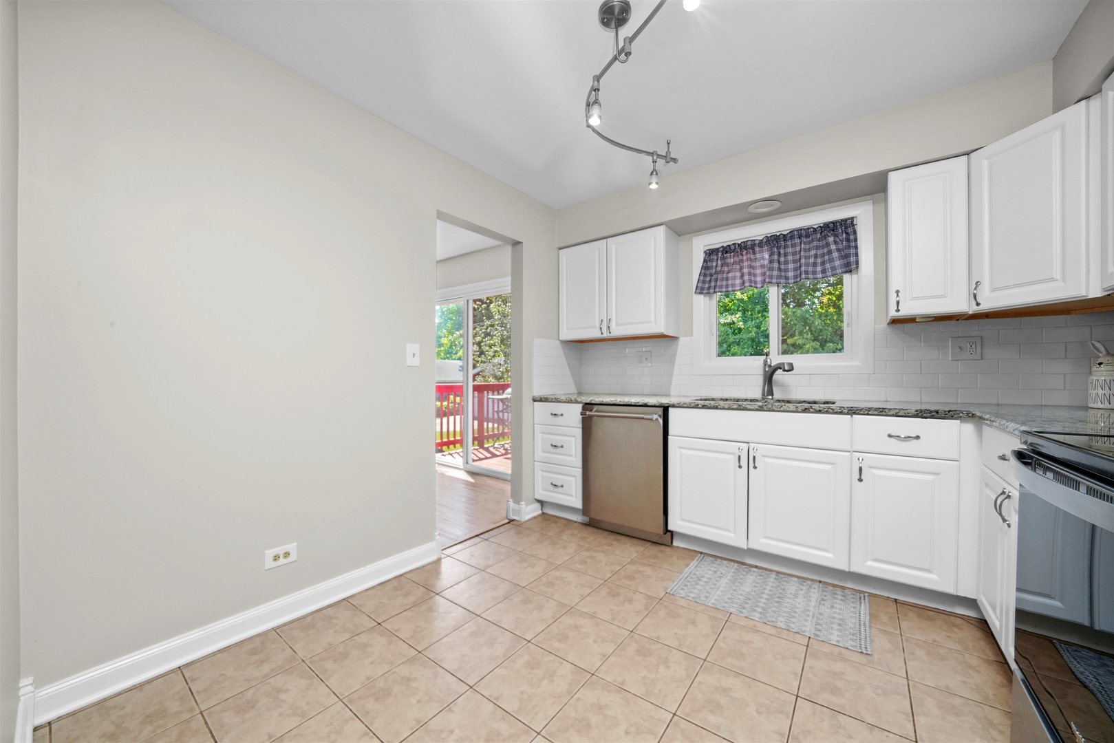 311 Harding Avenue Libertyville, IL 60048 - Photo 12 of 41 a kitchen with a white cabinets stove top oven and sink