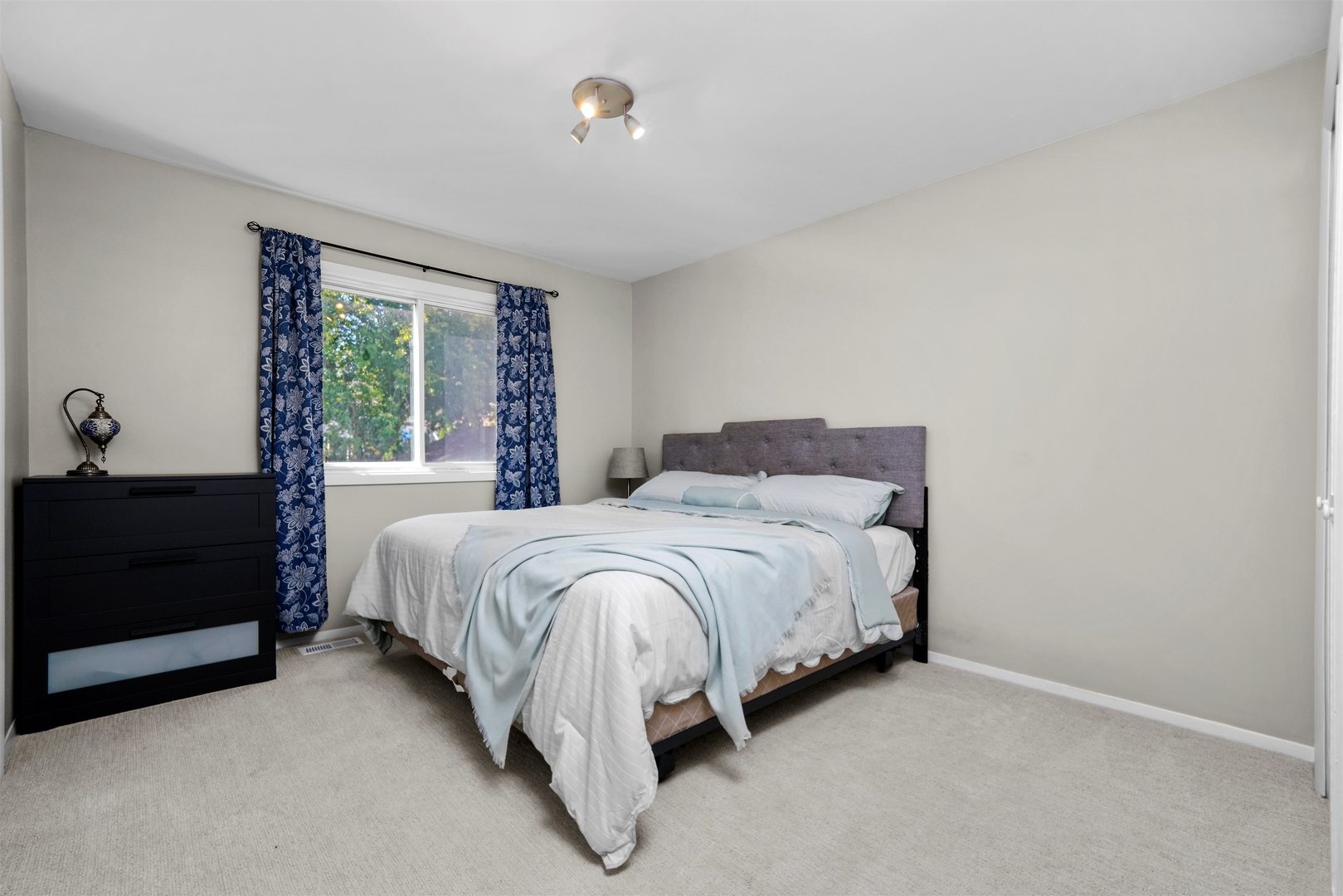 311 Harding Avenue Libertyville, IL 60048 - Photo 13 of 41 a bed sitting in a bedroom next to a window