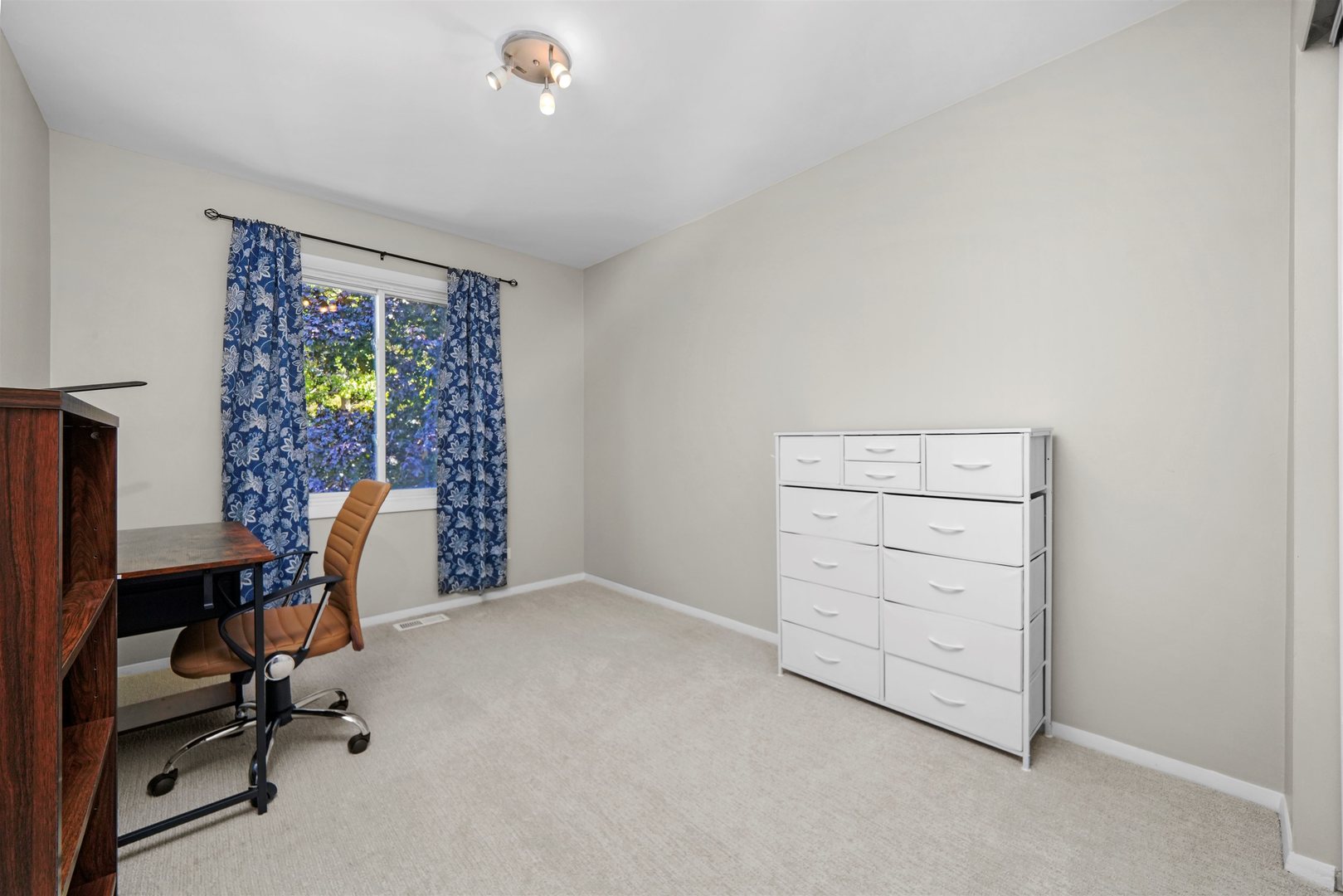 311 Harding Avenue Libertyville, IL 60048 - Photo 15 of 41 a view of a workspace with furniture and a window
