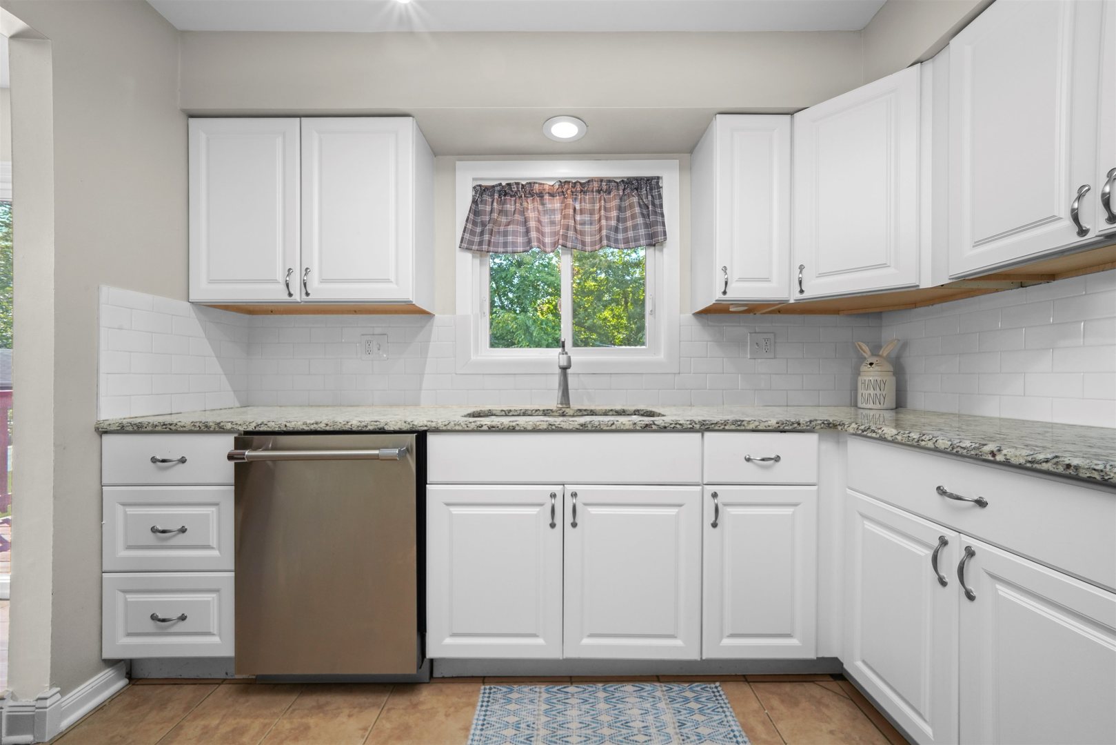 311 Harding Avenue Libertyville, IL 60048 - Photo 10 of 41 a kitchen with white cabinets and white appliances