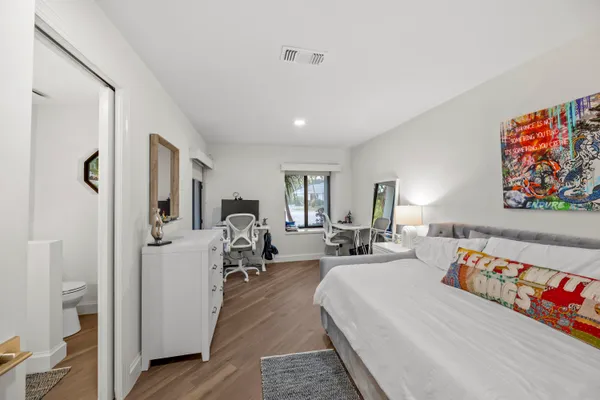 a bed room with bed and a couch