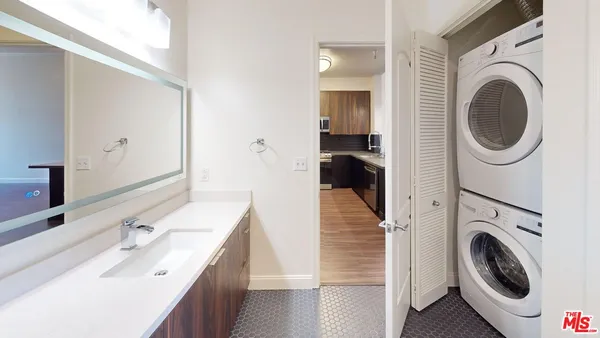 a view of a kitchen with washer and dryer