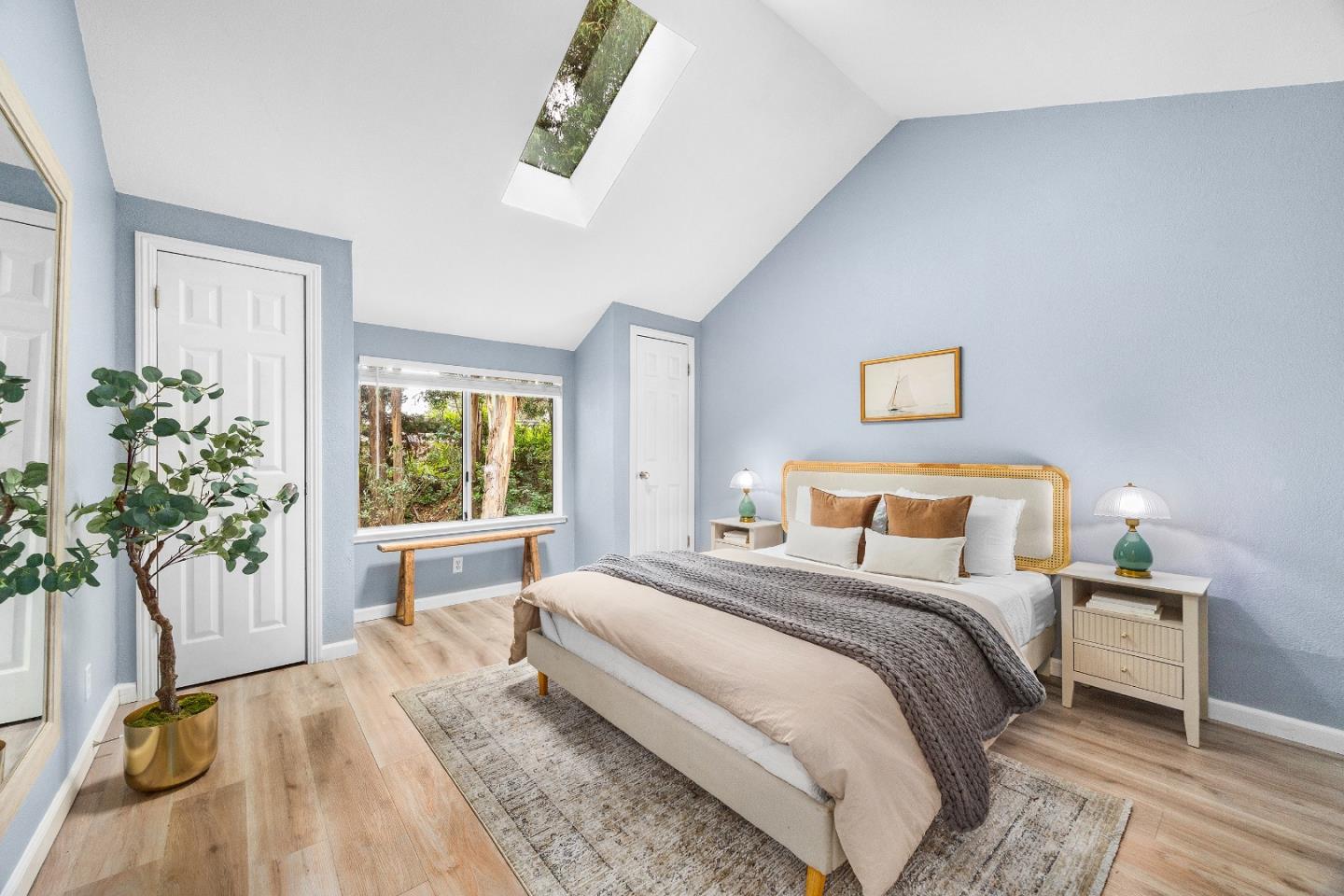 1644 Ocean Street Santa Cruz, CA 95060 - Photo 32 of 60 a bedroom with a large bed and a potted plant