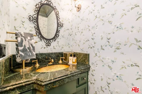 a bedroom with a bed and a fireplace