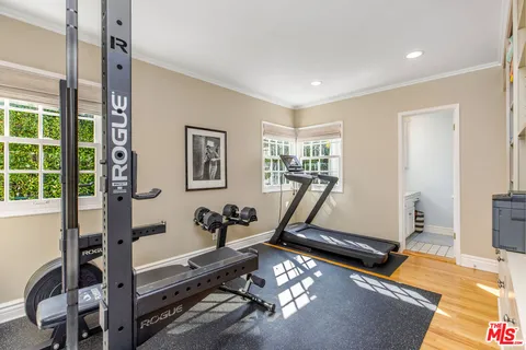 a kitchen with a refrigerator and cabinets