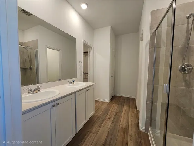 a bathroom with a shower sink and mirror