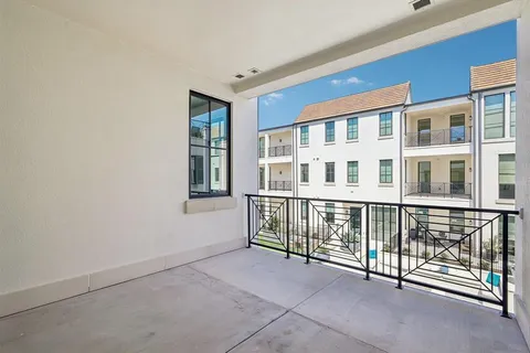 a view of a front door and porch with outdoor seating