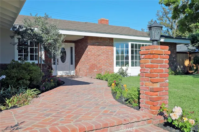 an aerial view of a house with outdoor space