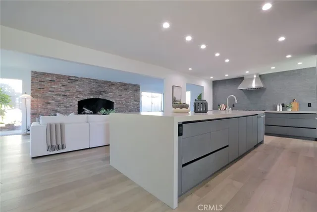 a kitchen with a stove a sink and a refrigerator