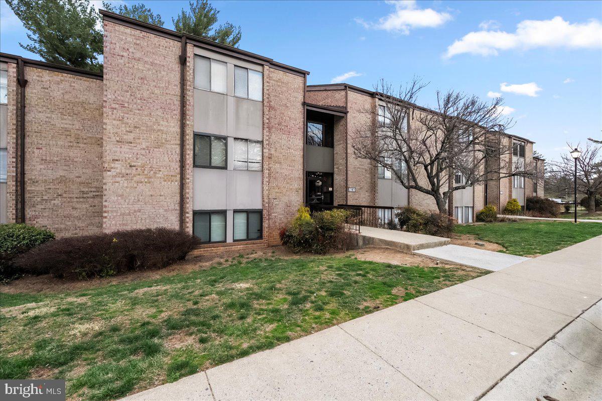 19030 Mills Choice Road, Unit 6 Gaithersburg, MD 20886 - Photo 1 of 21 a view of a house with a yard