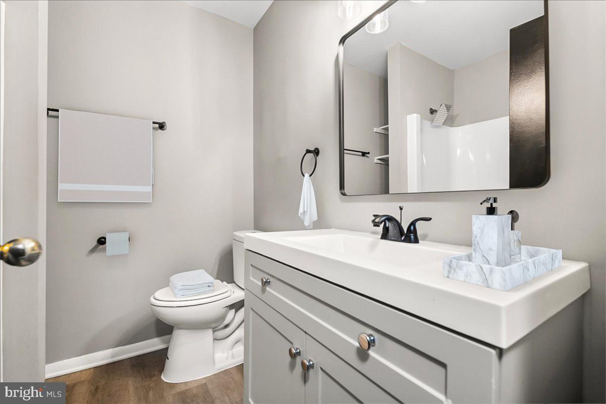 19030 Mills Choice Road, Unit 6 Gaithersburg, MD 20886 - Photo 13 of 21 a bathroom with a sink toilet and mirror