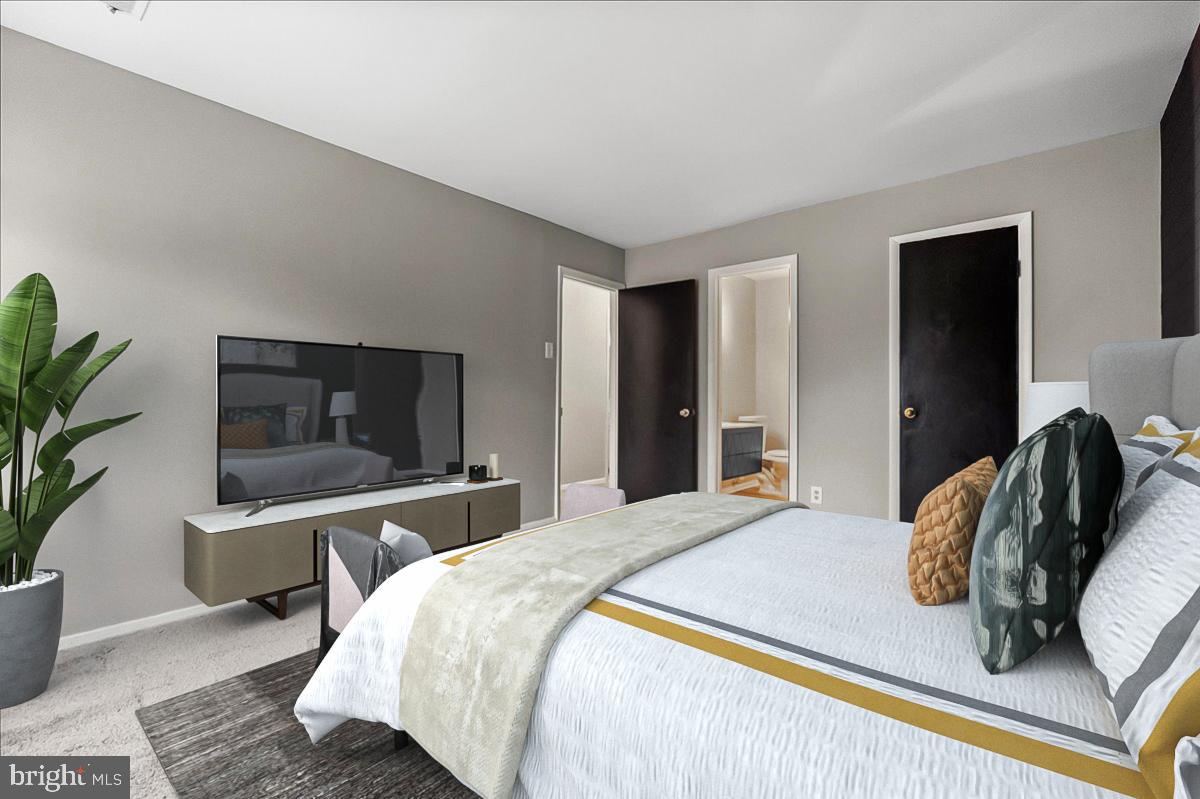 19030 Mills Choice Road, Unit 6 Gaithersburg, MD 20886 - Photo 18 of 21 a bedroom with a bed and wooden floor