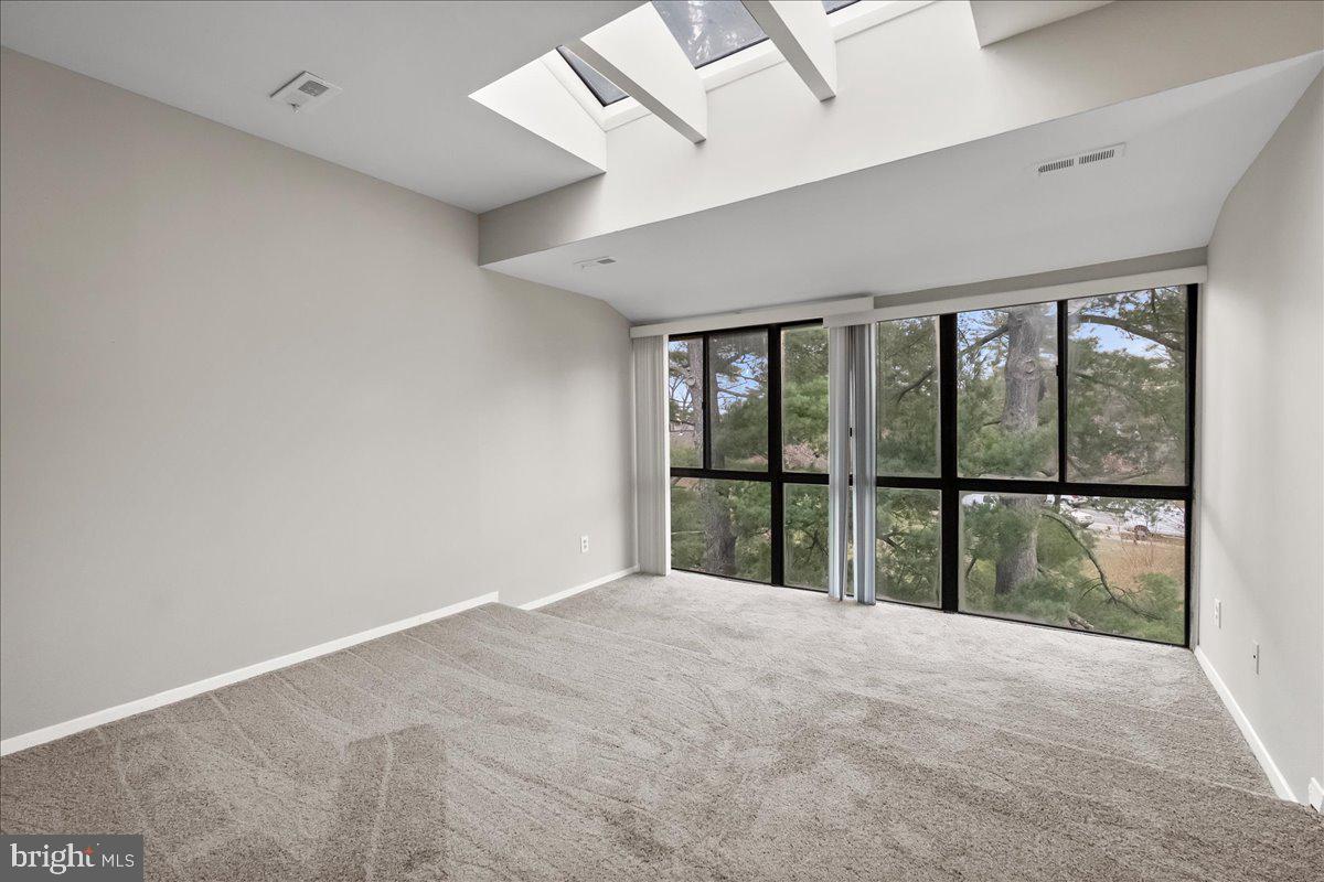 19030 Mills Choice Road, Unit 6 Gaithersburg, MD 20886 - Photo 3 of 21 a view of an empty room and window