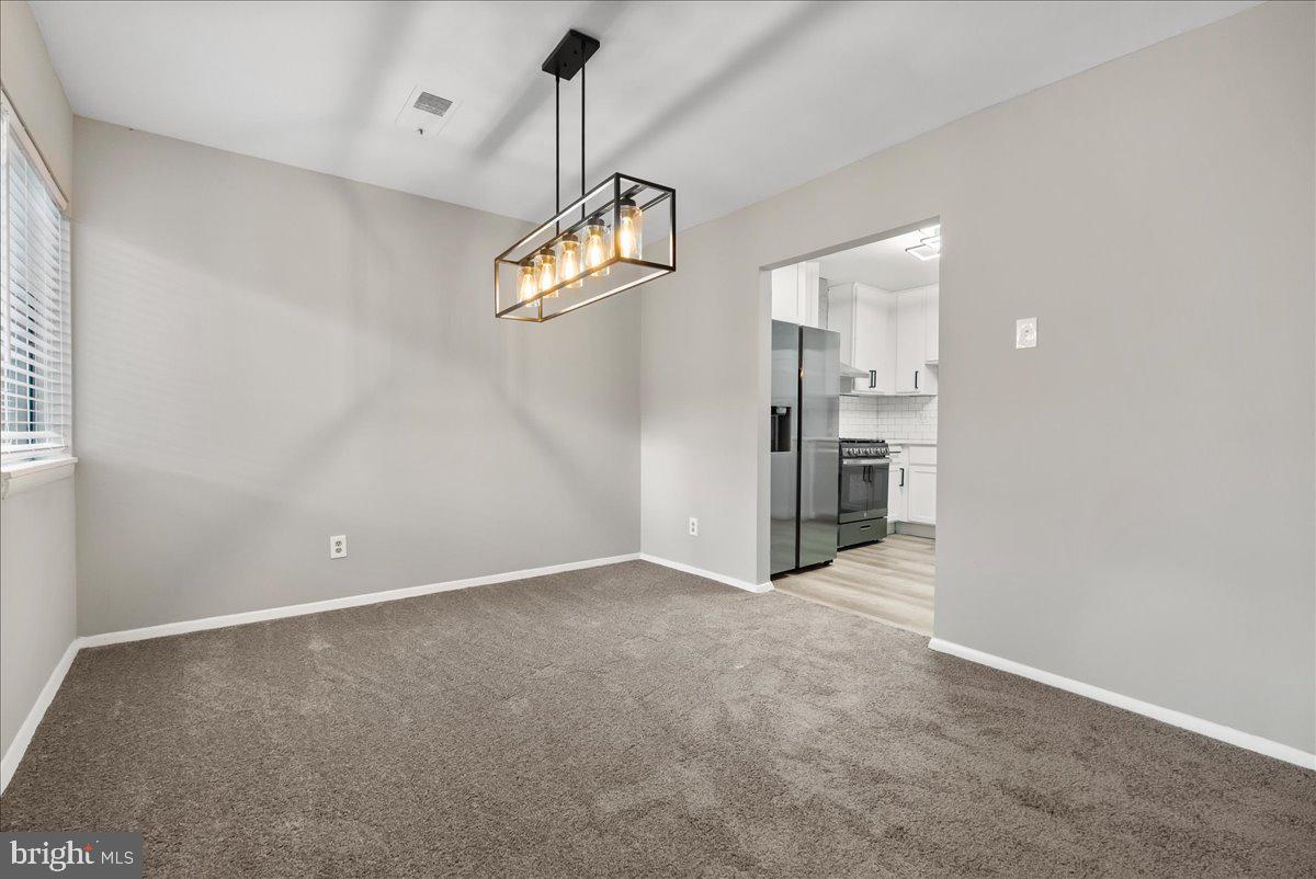 19030 Mills Choice Road, Unit 6 Gaithersburg, MD 20886 - Photo 5 of 21 a view of empty room with wooden floor