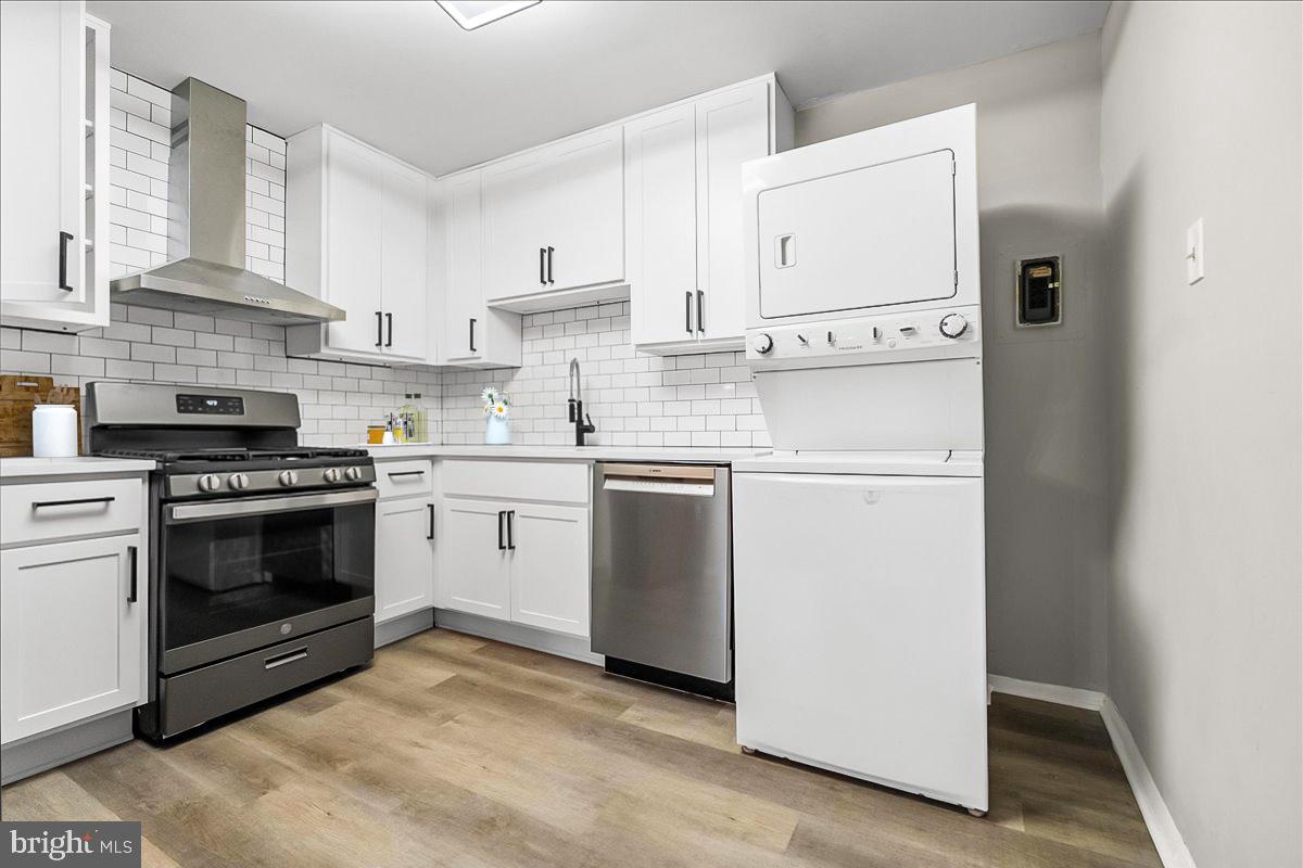 19030 Mills Choice Road, Unit 6 Gaithersburg, MD 20886 - Photo 9 of 21 a kitchen with cabinets stainless steel appliances and sink