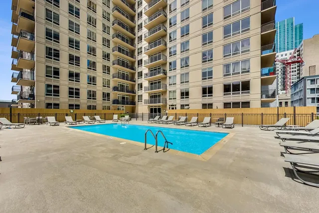 a view of swimming pool with outdoor seating