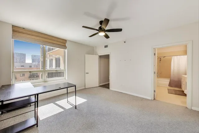 a view of workspace with wooden floor and furniture