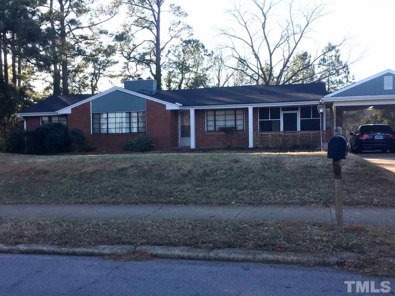 1128 Gorman Street Raleigh, NC 27606 - Photo 1 of 6 a view of a house with a yard