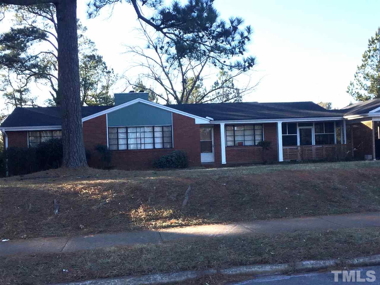1128 Gorman Street Raleigh, NC 27606 - Photo 2 of 6 a front view of a house with a yard and garage