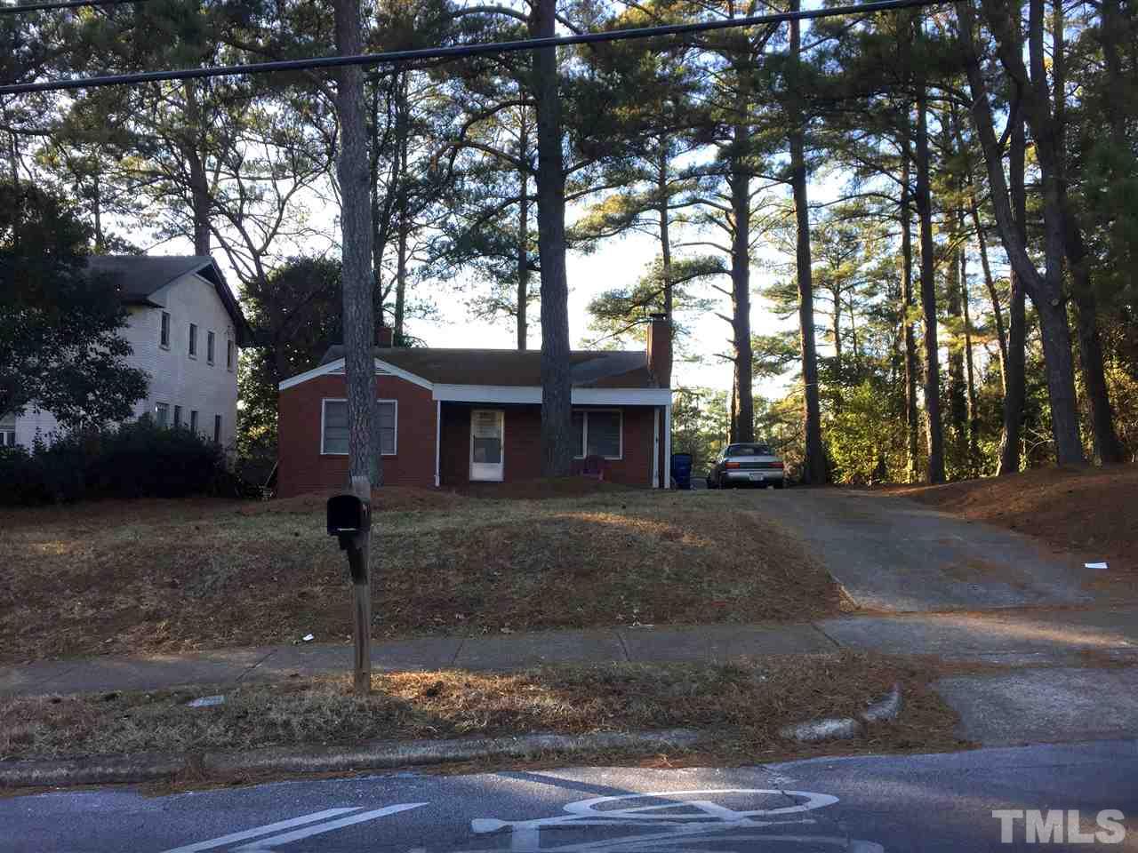 1128 Gorman Street Raleigh, NC 27606 - Photo 5 of 6 a front view of a house with a yard and tree s
